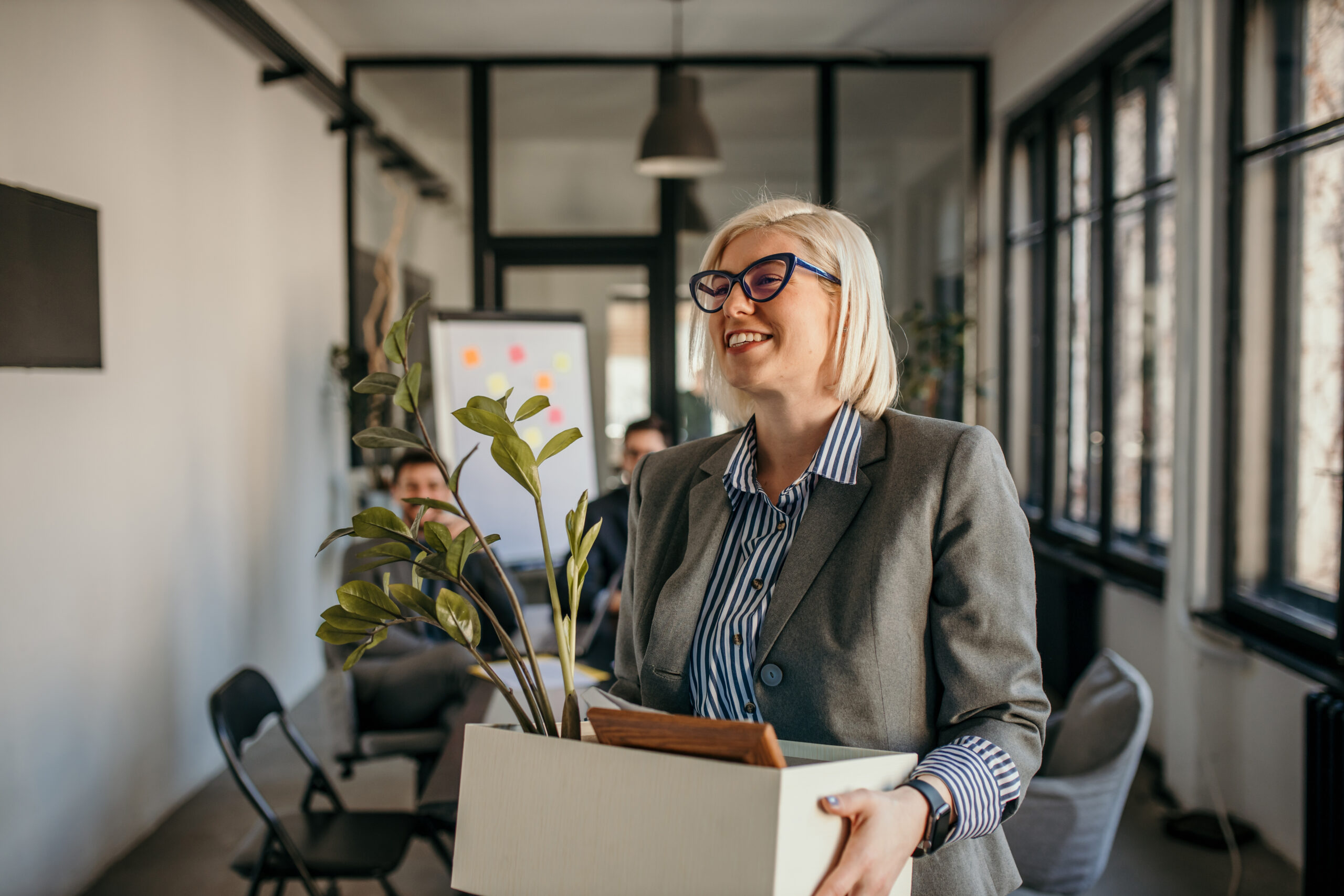 Professional taking her things to her new job in direct marketing